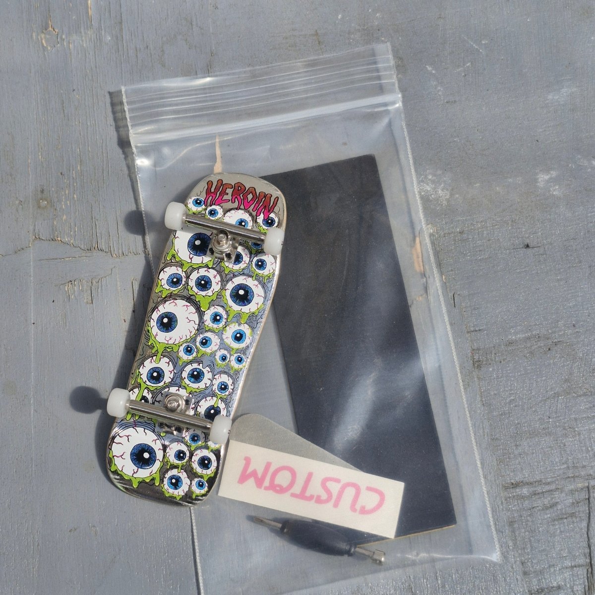 Custom Fingerboard Complete Pro Heroin Eyes silver foil - Fingerboard - Rollbrett Mission